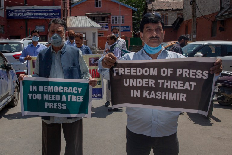 Kashmiri journalists protest in Srinagar against a new media policy announced this year that seeks to regulate reporting in the disputed region [File: Dar Yasin/AP]