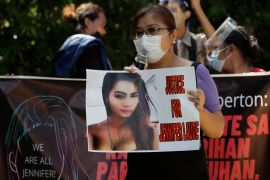 A protester holds a slogan with a photo of the killed transgender Filipino woman Jennifer Laude during a rally in Quezon City, the Philippines on September 11, 2020 [AP/Aaron Favila]