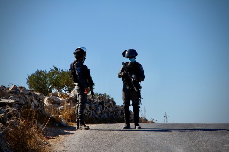 Israeli soldiers manning a checkpoint