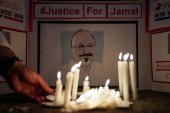 A candlelight vigil in front of the Saudi Embassy in the US for murdered journalist Jamal Khashoggi [File: Reuters]