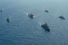 This handout photograph released by the Turkish Defence Ministry on August 12, 2020, shows Turkish seismic research vessel 'Oruc Reis' (C) as it is escorted by Turkish Naval ships in the Mediterranean Sea, off Antalya on August 10, 2020. - Greece on August 11, demanded that Turkey withdraw a research ship at the heart of their growing dispute over maritime rights and warned it would defend its sovereignty, calling for an emergency meeting of EU foreign ministers to resolve the crisis. Tensions were stoked August 10, when Ankara dispatched the research ship Oruc Reis accompanied by Turkish naval vessels off the Greek island of Kastellorizo in the eastern Mediterranean.