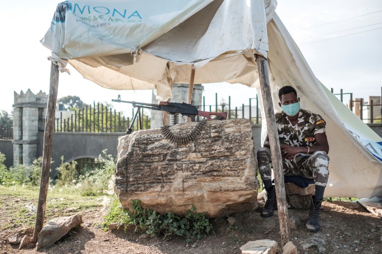 A member of Tigray police is pictured at a checkpoint in the region [File: AFP]