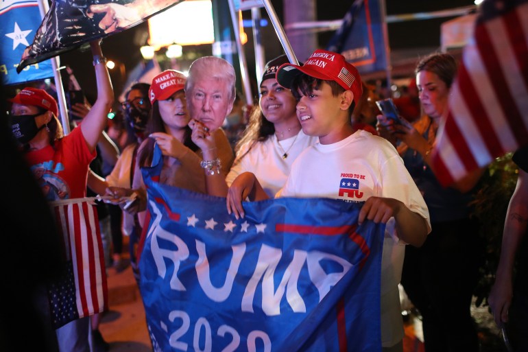 MIAMI, FLORIDA- NOVEMBER 03: Supporters of President Donald Trump cheer for him outside of the Versailles restaurant as they await results of the presidential election on November 03, 2020 in Miami, Florida