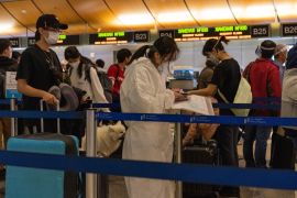 US airport coronavirus check-in [Bloomberg]