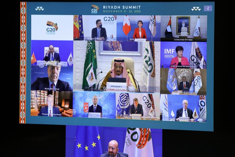 European Council President Charles Michel, on screen bottom, participates in a virtual G20 meeting, hosted by Saudi Arabia, at the European Council building in Brussels [Yves Herman/Pool/AP Photo]