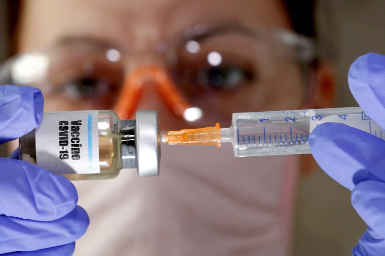Approximately 40 million doses of the Pfizer and Moderna vaccines, both of which require two shots about four weeks apart, will be available by the end of the year, US officials said [File: Dado Ruvic/Reuters]