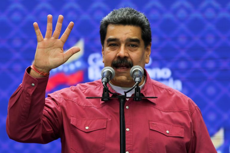 Venezuela's President Nicolas Maduro gestures as he speaks to the media after voting in December 2020.