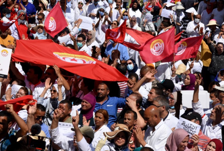 Tunisian health workers attend a protest