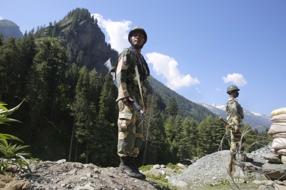 Indian paramilitary soldiers stand guard at check post along a highway leading to Ladakh, at Gagangeer some 81 kilometers from Srinagar [Farooq Khan/EPA]