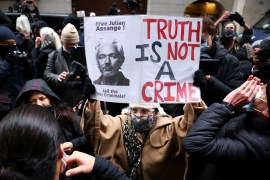 People react after a judge ruled that WikiLeaks founder Julian Assange should not be extradited to the United States, outside the Old Bailey, the Central Criminal Court, in London on January 4, 2021 [Henry Nicholls/Reuters]