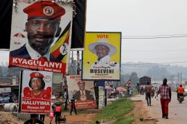 Elections billboards for Uganda&#39;s President Yoweri Museveni, and opposition leader and presidential candidate Robert Kyagulanyi, also known as Bobi Wine, are seen on a street in Kampala, Uganda January 12, 2021 [Baz Ratner/Reuters]