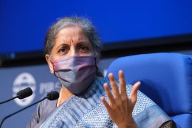 Nirmala Sitharaman, India's finance minister, wears a protective mask while speaking during a news conference in New Delhi, India