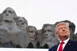 Former President Donald Trump stands at Mount Rushmore National Memorial, near Keystone, South Dakota on July 3, 2020 [File: AP Photo/Alex Brandon]