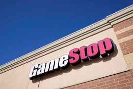 A GameStop sign is seen above a store on January 28, 2021, in Urbandale, Iowa [AP/Charlie Neibergall]
