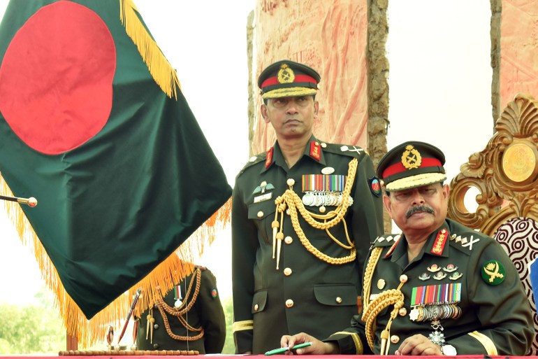 Army chief General Aziz Ahmed, right, told reporters in Dhaka that the allegations against him and his family were false, concocted and part of a conspiracy by vested groups [File: STR/AFP]
