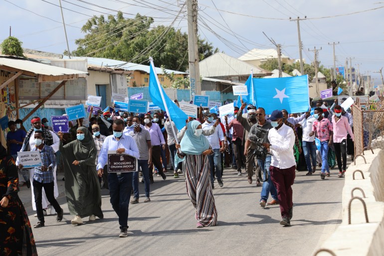 Supporters of different opposition presidential candidates demonstrate in Mogadishu on February 19, 2021. [AFP]