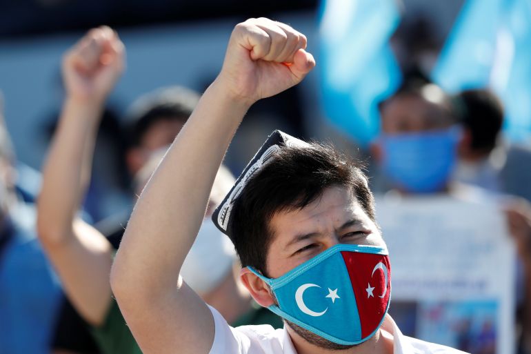 Ethnic Uighur demonstrators shout slogans during a protest against China, in Istanbul, Turkey
