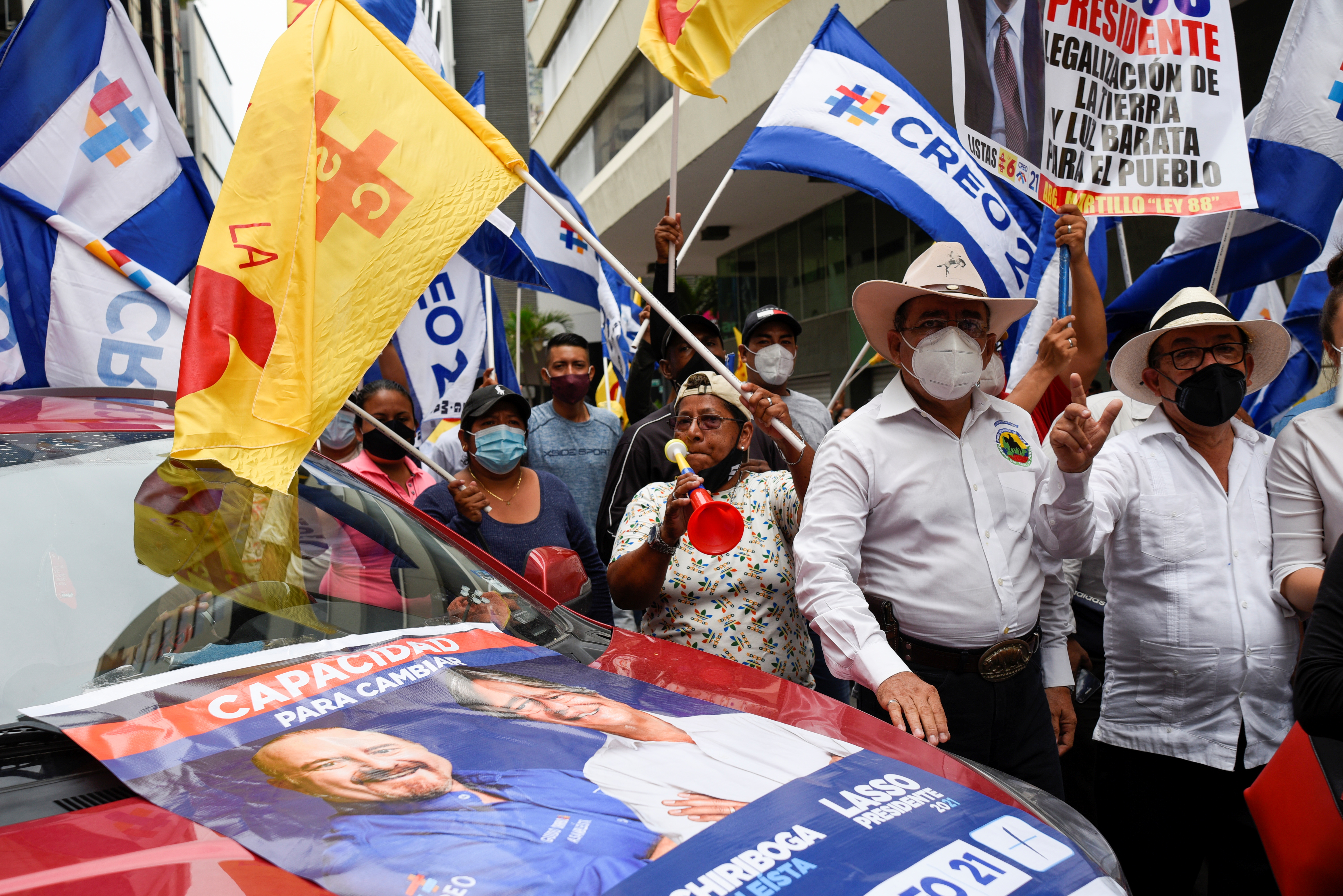 Supporters of Ecuadorean presidential candidate Guillermo Lasso gather before his closing campaign rally in Guayaquil, Ecuador on February 4 [Santiago Arcos/Reuters]