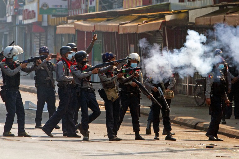 Riot police fire tear gas canisters during protests against the military coup in Yangon [Reuters]