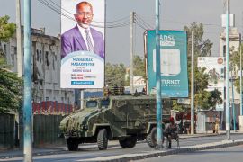 Security forces block a street with an armoured personnel carrier during protests against the government and the delay of the country&#39;s election in the capital Mogadishu, Somalia, Feb 19, 2021. [AP Photo]