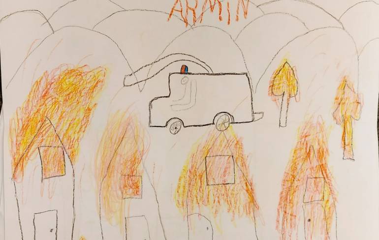 Image of fire by child in Lesbos