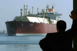 A man looks as the world's biggest Liquefied Natural Gas (LNG) tanker DUHAIL