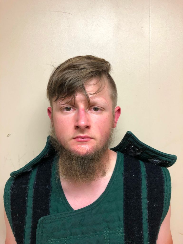 This handout booking photo released by the Crisp County Sheriff’s Office on March 16, 2021, shows 21-year-old shooting suspect Robert Aaron Long [Crisp County Sheriff’s Office Handout/AFP]