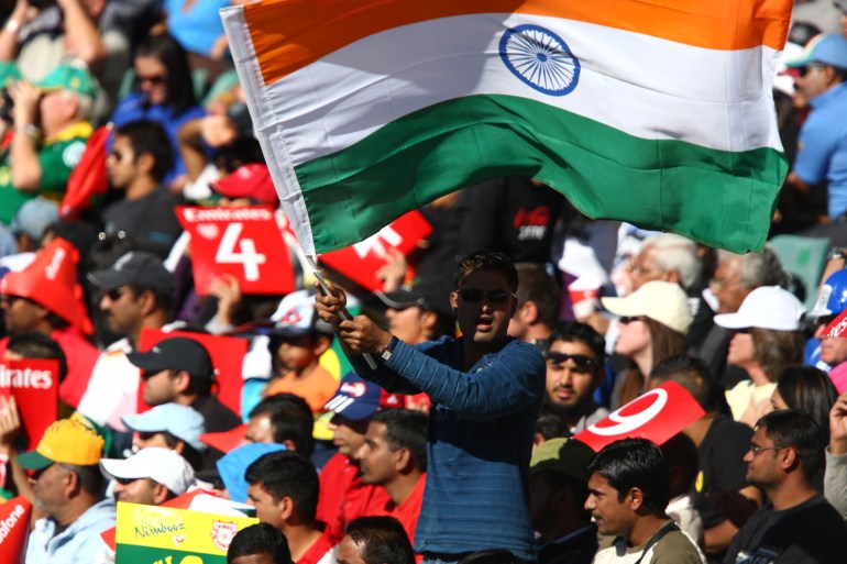 A cricket fan waves an Indian flag during the 2009 Indian Premier League (IPL) T20 cricket match in Johannesburg, South Africa
