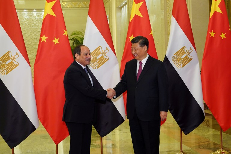 Chinese President Xi Jinping shakes hands with Egypt's President Abdel Fattah El-Sisi