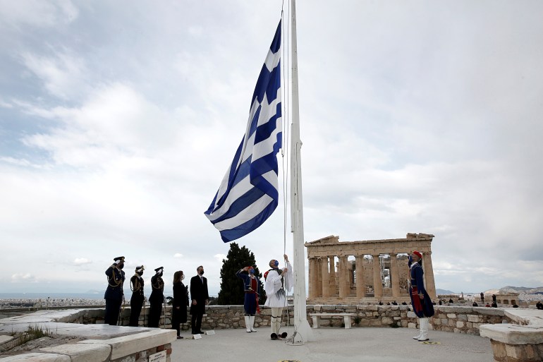 Greek flag being hoisted
