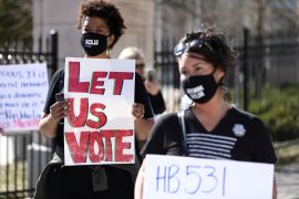 Protesters gather outside of the Georgia State Capitol to protest new legislations that would place tougher restrictions on voting in Georgia, in Atlanta, March 4, 2021 [Dustin Chambers/Reuters]