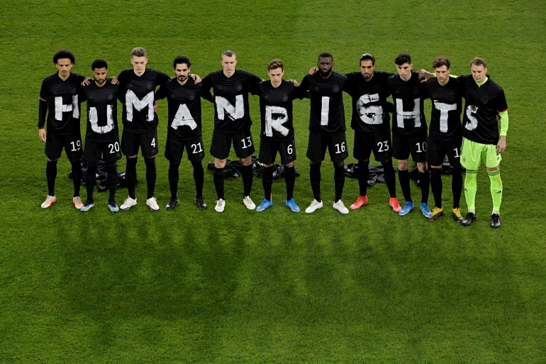 German players staging their protest ahead of kickoff in the World Cup qualifier
