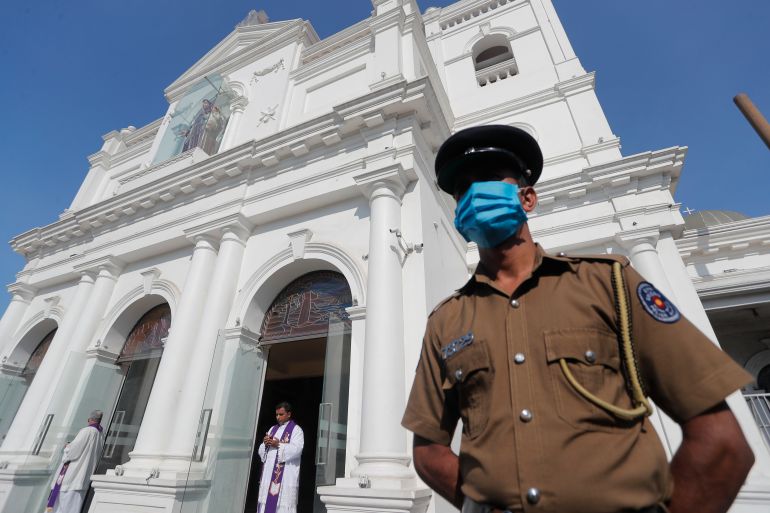 A Sri Lankan police officer stands guard outside St. Anthony's church