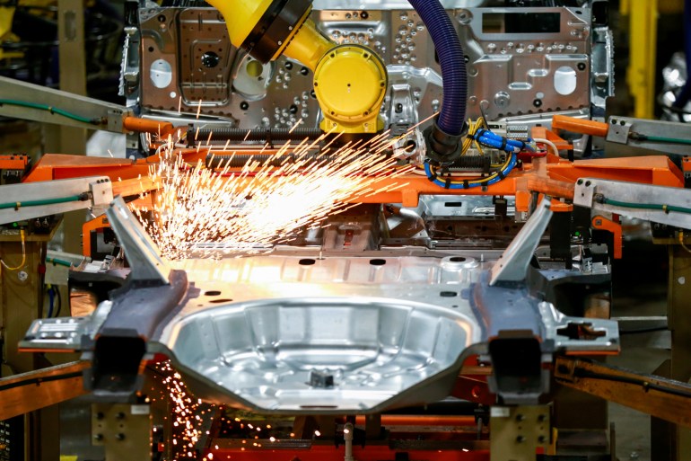 machines work on an assembly line for Ford vehicles at Ford's Chicago Assembly Plant in Chicago, USA