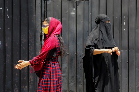 A burqa is an outer garment worn to cover the entire body and the face and is used by some Muslim women [Chamila Kareunarathne/EPA]