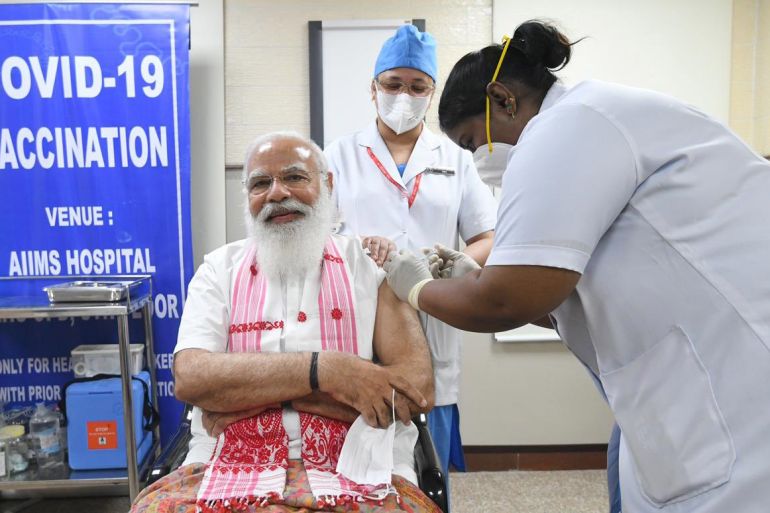 Modi takes homegrown COVID jab as India expands vaccination drive | Narendra Modi News | Al Jazeera