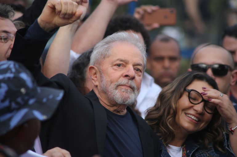 Luiz Inacio Lula da Silva greets supporters