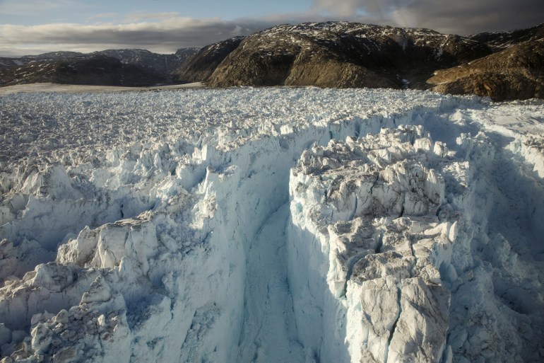 FILE PHOTO: A large crevasse forms near the calving front of the Helheim glacier near Tasiilaq, Greenland
