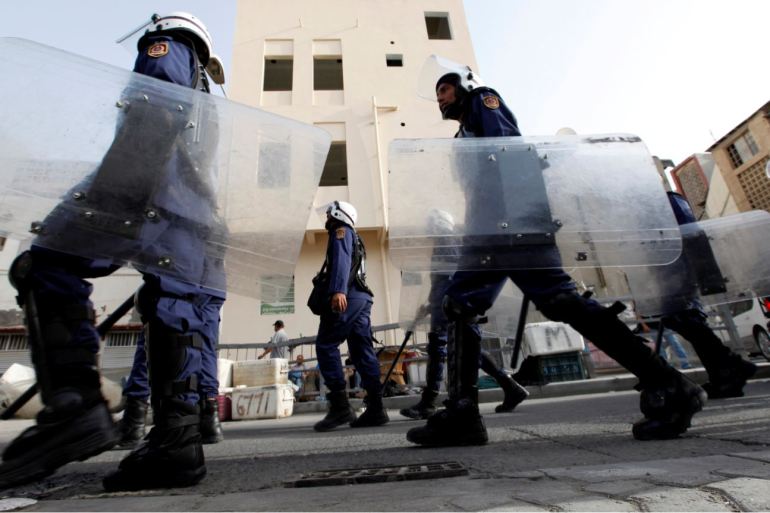 FILE PHOTO: Riot police patrol streets near British embassy prior to anti-government protest in support of Bahraini human rights activist Abdulhadi al-Khawaja in Manama