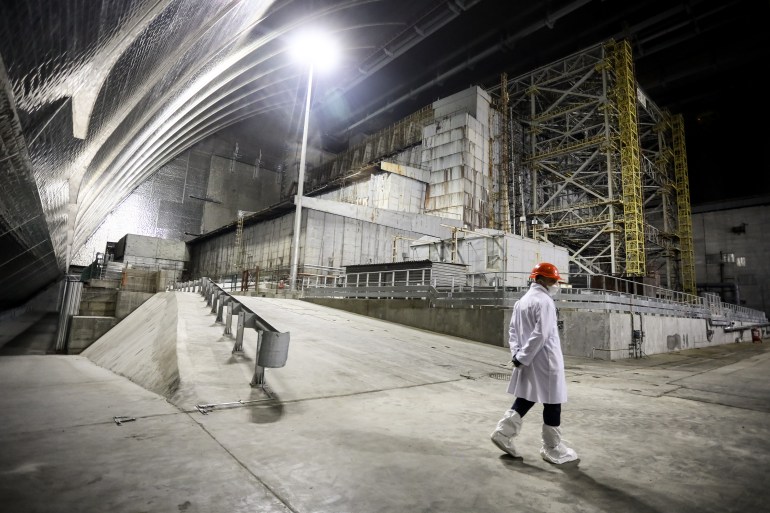 Chernobyl nuclear power plant worker walks inside the new Safe Confinement