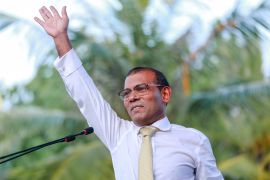 Former president of the Maldives Mohamed Nasheed waves as hi addresses the country after returning from exile to the Maldives, in Male on November 1, 2018. – Former Maldives president Mohamed Nasheed returned home from exile on November 1, two days after the country’s Supreme Court withdrew a warrant for his arrest. Nasheed, who had been jailed for 13 years on a controversial terrorism charge, was welcomed at Male airport by president-elect Ibrahim Mohamed Solih and hundreds of supporters. (Photo by Ahmed SHURAU / AFP)