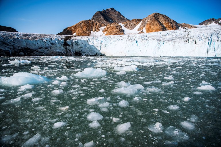 This photo taken in August 2019 shows bergy bits and growlers floating in front of the Apusiajik glacier, near Kulusuk, a settlement in the Sermersooq municipality located on the island of the same name on the southeastern shore of Greenland