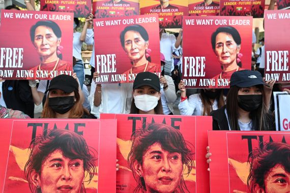 Protesters holding up placards calling for the release of Aung San Suu Kyi.