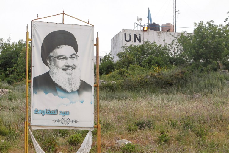 A poster depicting Lebanon's Hezbollah leader Sayed Hassan Nasrallah is seen in Marwahin, southern Lebanon [Aziz Taher/Reuters]