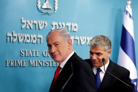 Israeli Prime Minister Benjamin Netanyahu and Finance Minister Yair Lapid leave after a joint news conference in Jerusalem on July 3, 2013 [File: Reuters/Ronen Zvulun]