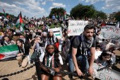 People protest against the Israeli violence against Palestinians during a rally at the Washington Monument in Washington, DC on May 15, 2021 [Reuters/Yuri Gripas]