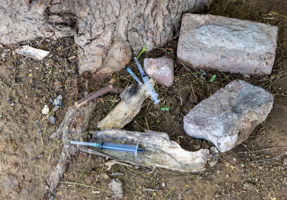 Syringes that were used to treat villagers with breathing difficulties seen at the village clinic. [Danish Siddiqui/Reuters]