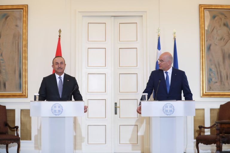 Greek Foreign Minister Nikos Dendias and his Turkish counterpart Mevlut Cavusoglu