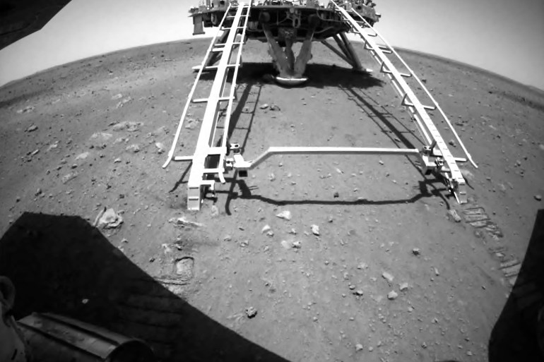 A landing platform and the surface of Mars seen from a camera on the Chinese Mars rover Zhurong [China National Space Administration via AP]