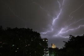Lightning strikes over residential apartments during a thunderstorm